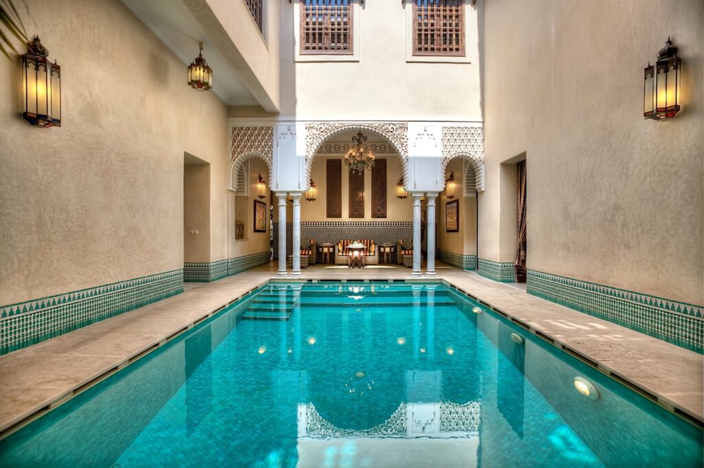 The inviting courtyard swimming pool at Riad Kniza, a family-friendly hotel in Marrakech