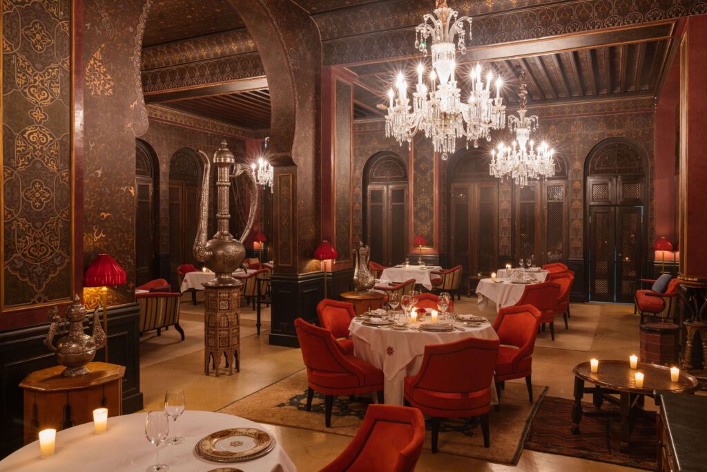 An opulent dining room with chandeliers at the Selman Marrakech, one of the best 5-star hotels in Marrakech