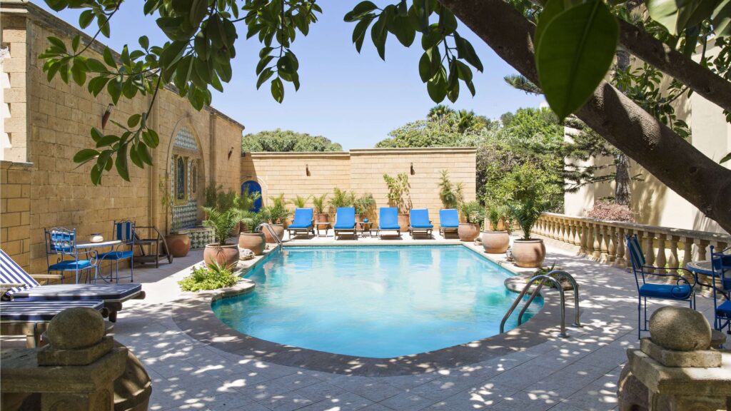 Sun loungers beside the swimming pool at Villa Quieta, one of the best family hotels in Essaouira